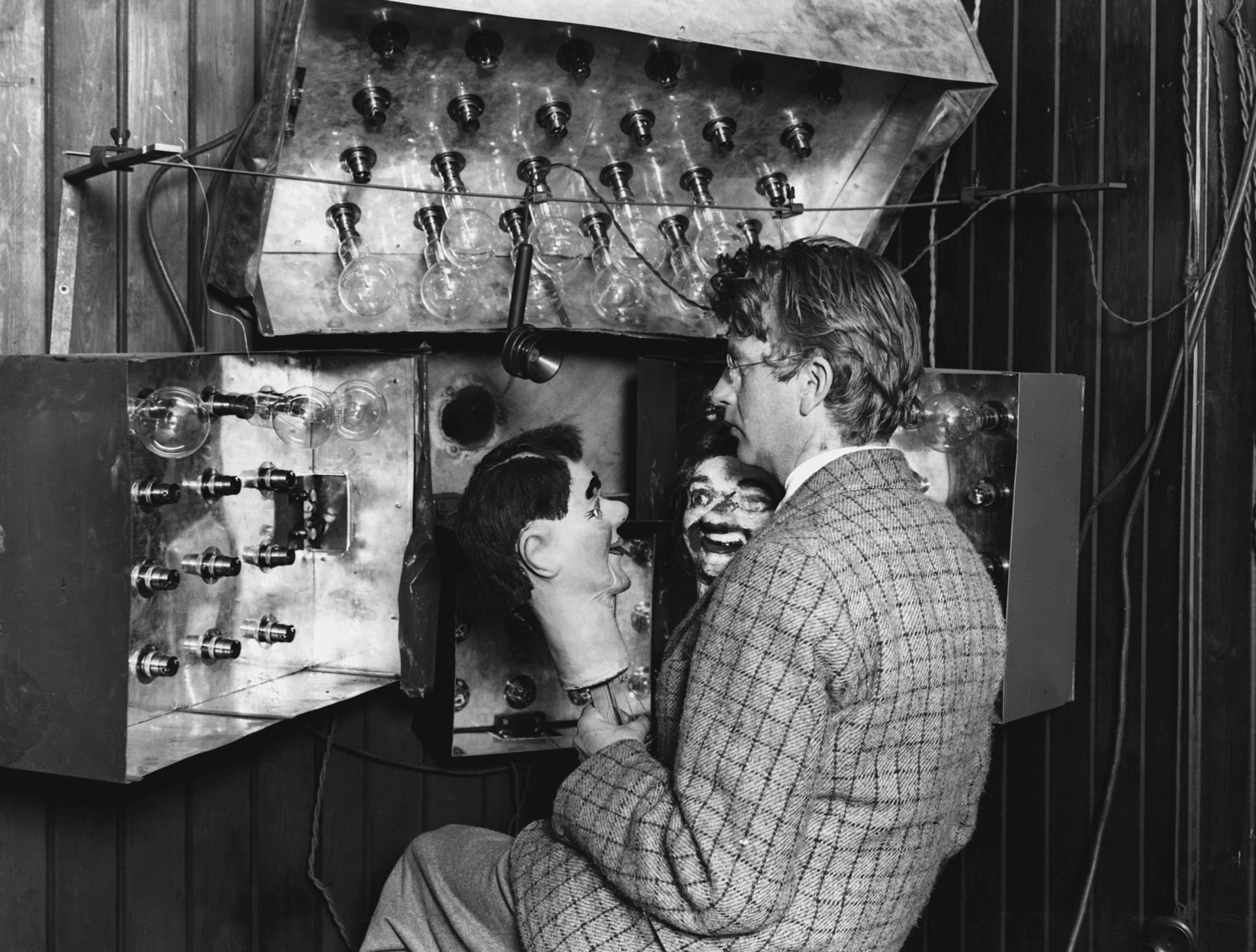 John Logie Baird with his mechanical television apparatus and the Stooky Bill puppet.