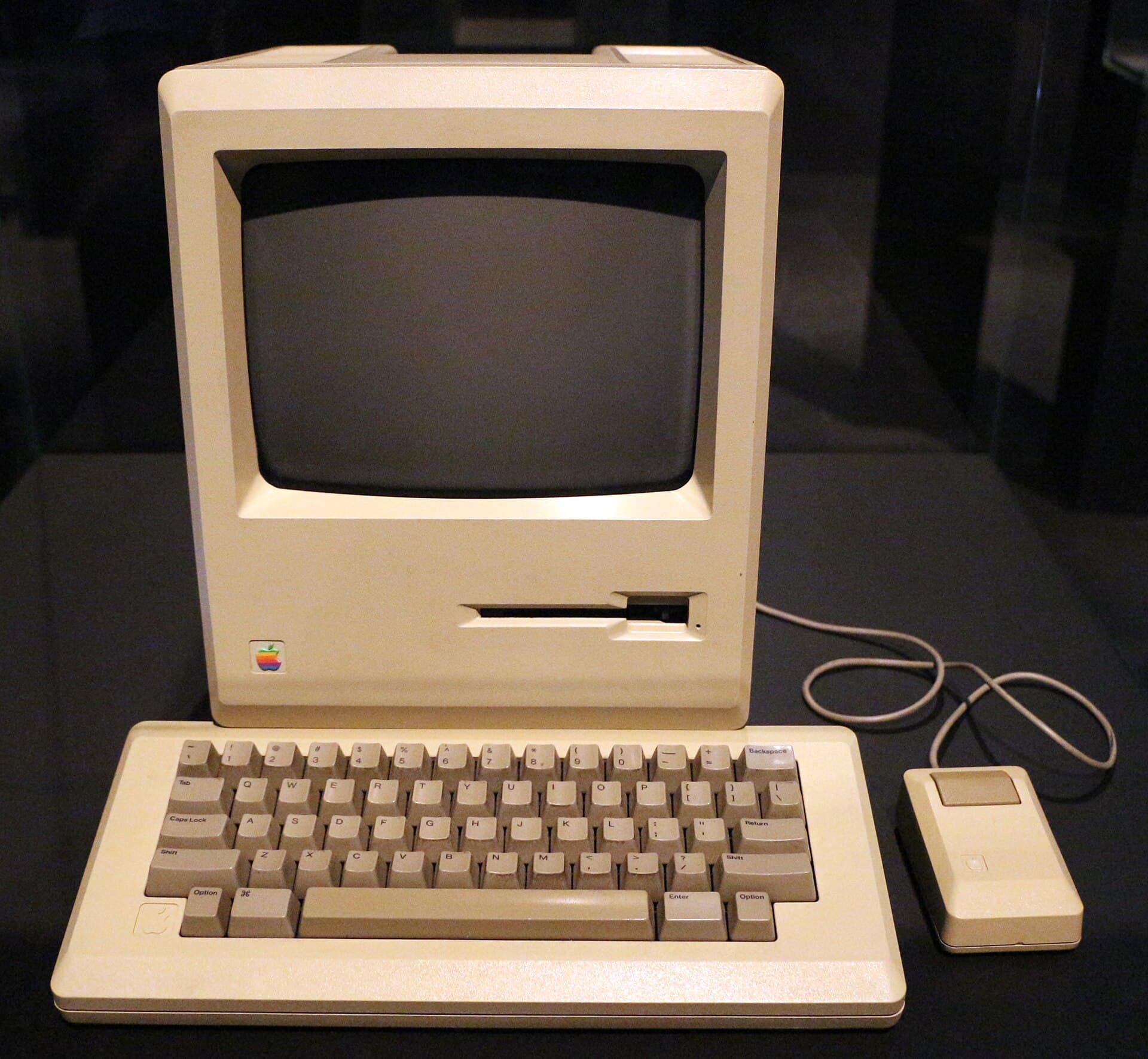 An original 1984 Macintosh 128K with its keyboard and mouse.